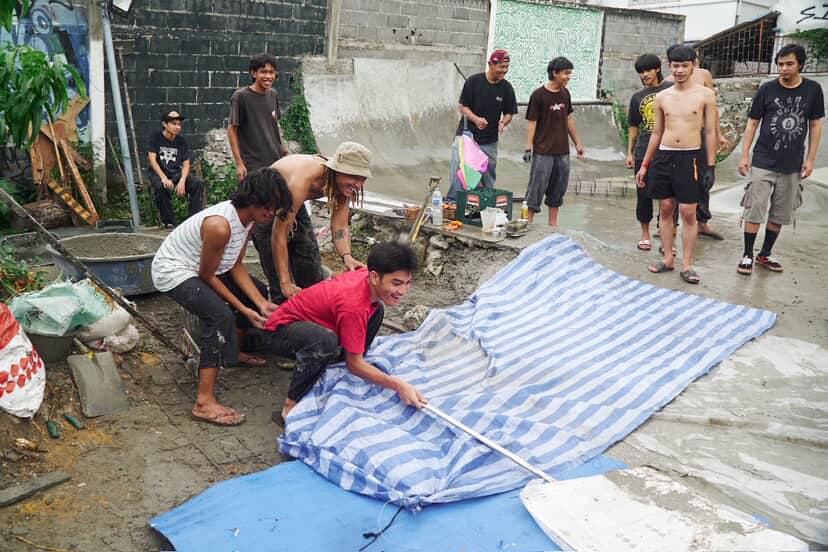 Community members working together on construction